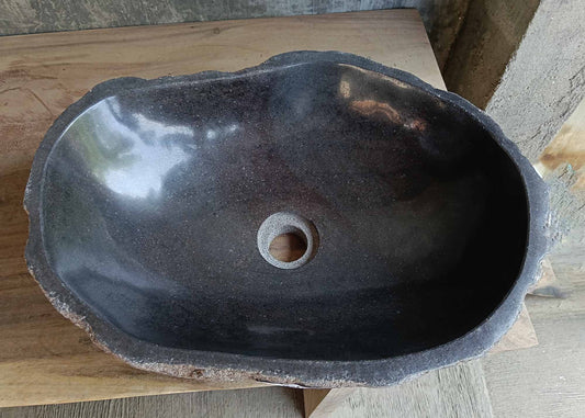 Top view of oval dark gray river stone sink 6666-4835 with polished interior
