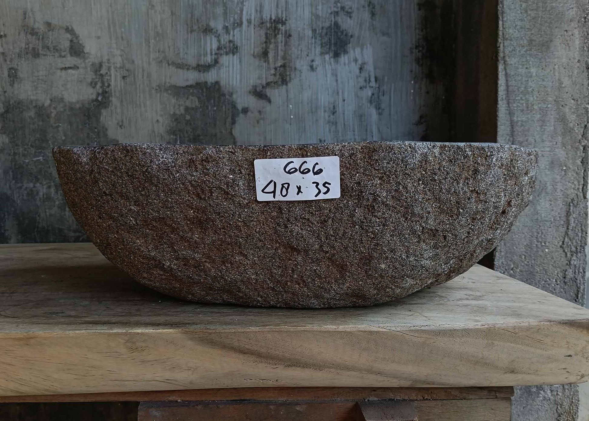 Front view of handcrafted oval dark gray river stone sink 6666-4835
