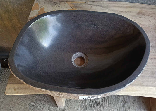 Top view of oval dark gray river stone sink 6667-4633 with polished interior
