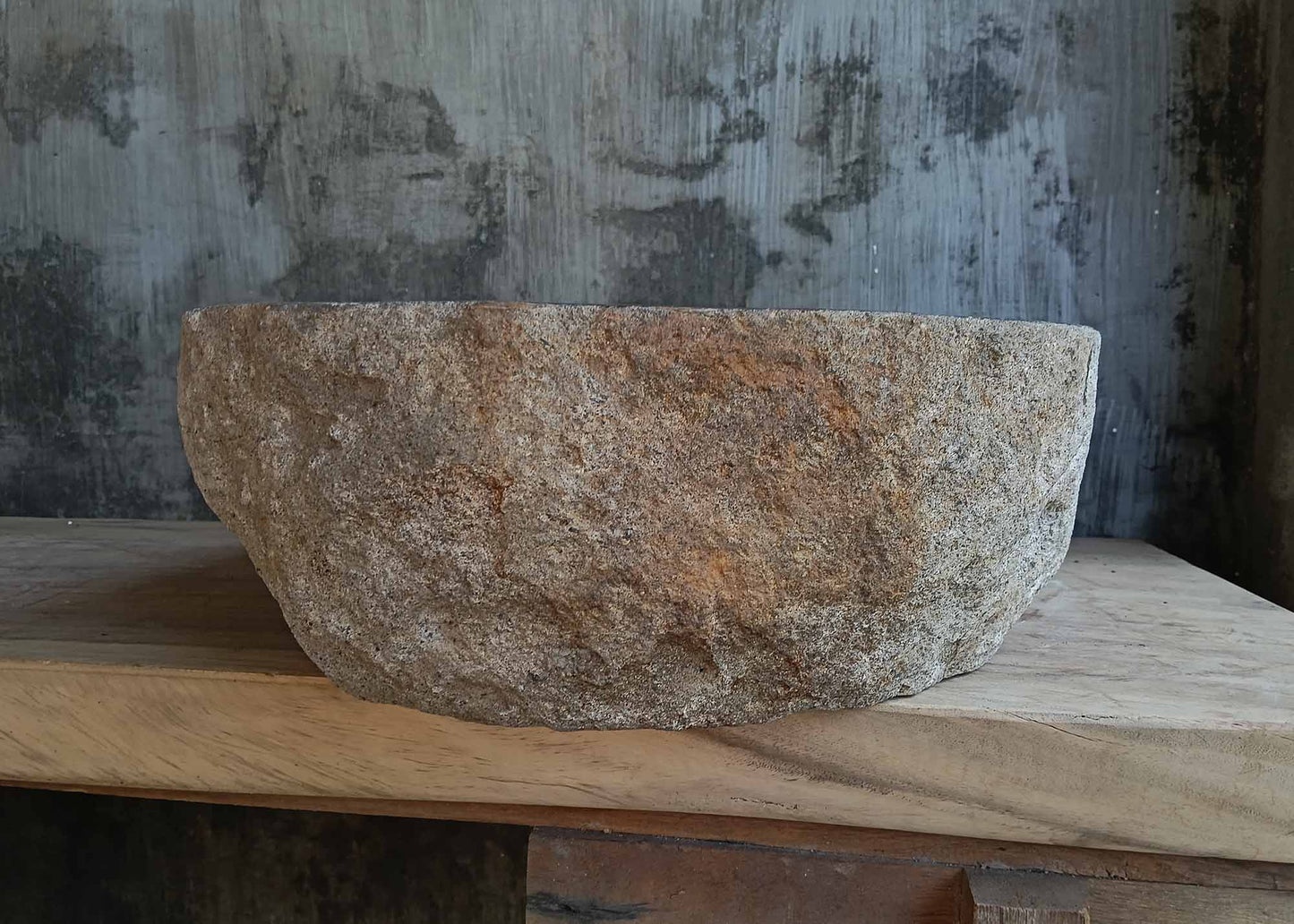Left side view of dark gray river stone sink 6672-4939 highlighting rough outer shell
