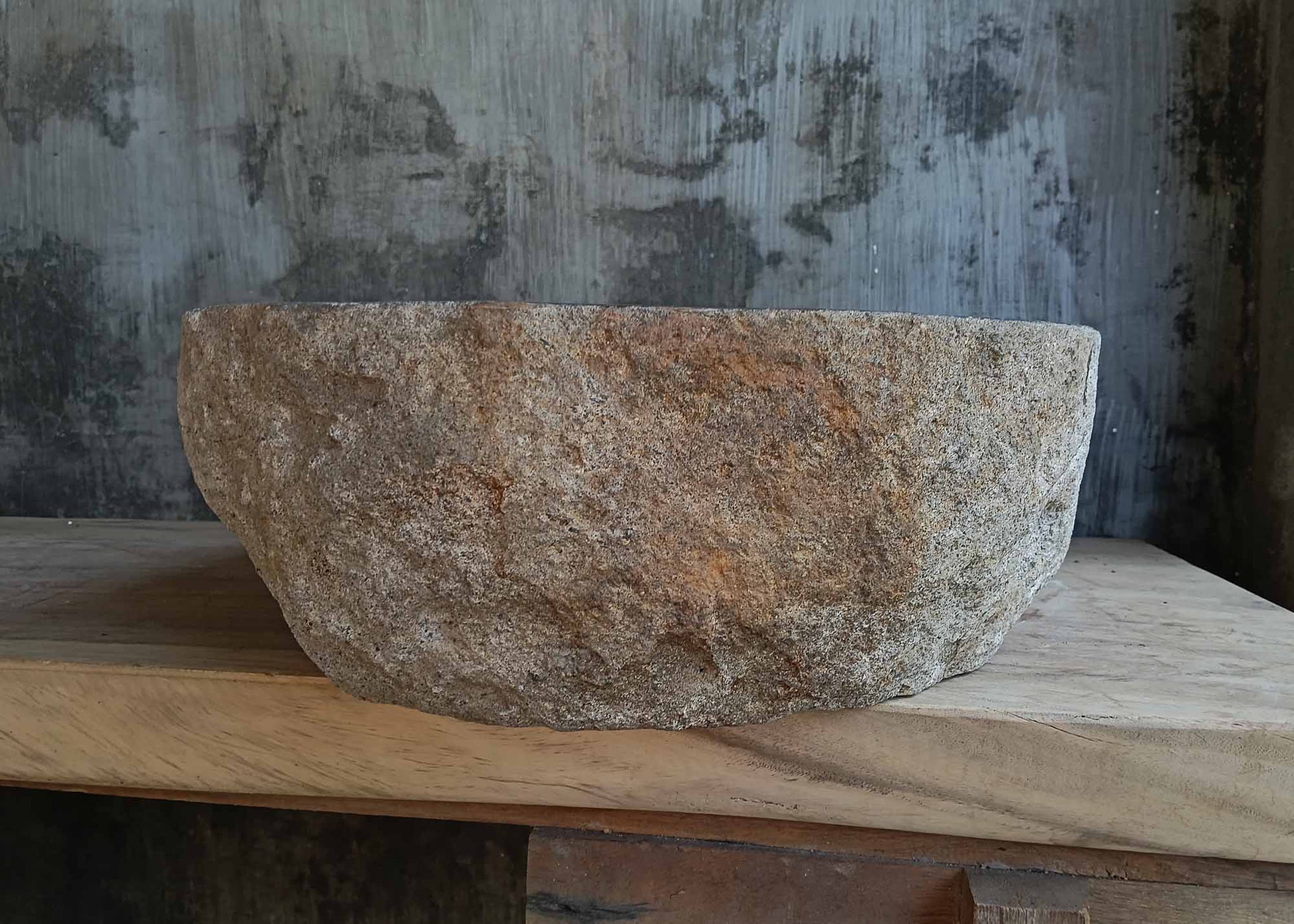 Left side view of dark gray river stone sink 6672-4939 highlighting rough outer shell
