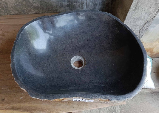 Top view of handcrafted river stone sink 6672-4939 with polished dark gray oval interior
