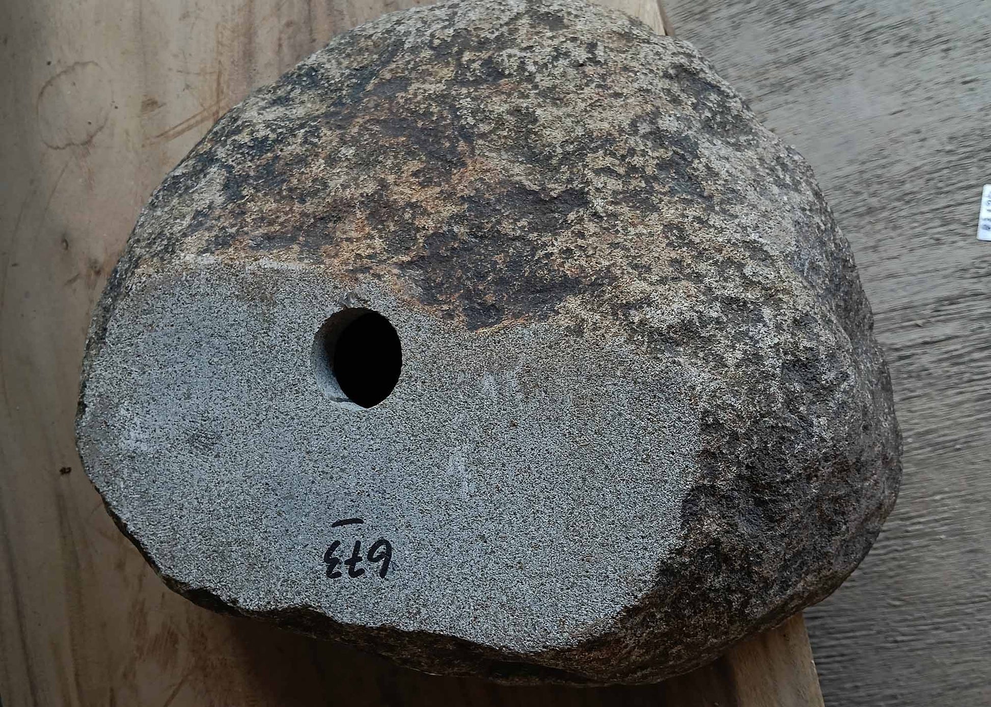 Bottom view of handcrafted oval dark gray river stone sink 6673-3835
