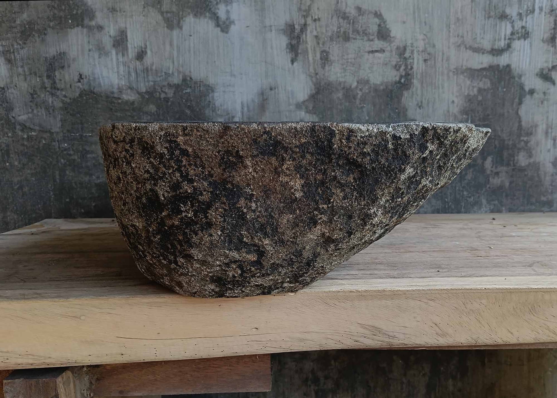 Left side view of river stone sink 6673-1515 highlighting rugged textured exterior
