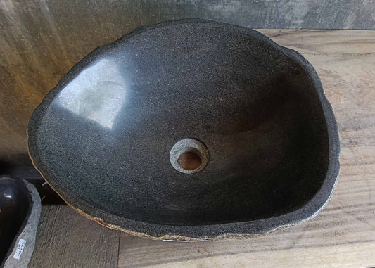 Top view of handcrafted river stone sink 6673-1515 with dark gray polished interior and organic rounded shape
