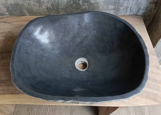 Top view of handcrafted dark gray river stone sink 6676-5343 with polished interior
