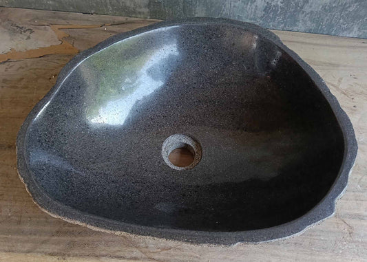 Top view of handcrafted dark gray river stone sink 6677-4335 with polished interior
