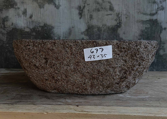 Front view of handcrafted dark gray river stone sink 6677-4335 with natural rough exterior
