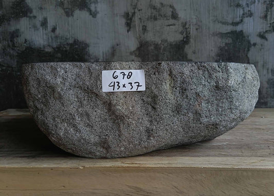 Front view of handcrafted dark gray river stone sink 6678-4337 with natural rough exterior

