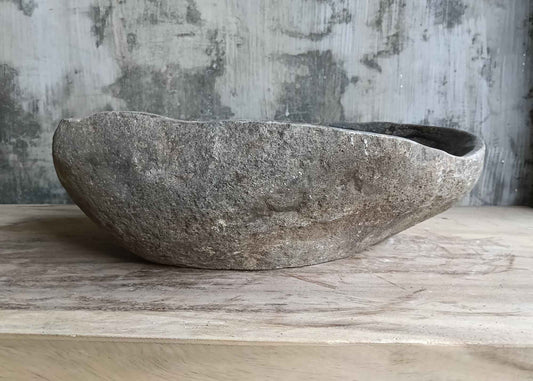 Front side view of handcrafted 19×14 inch stone sink with mixed color bands and textured surface
