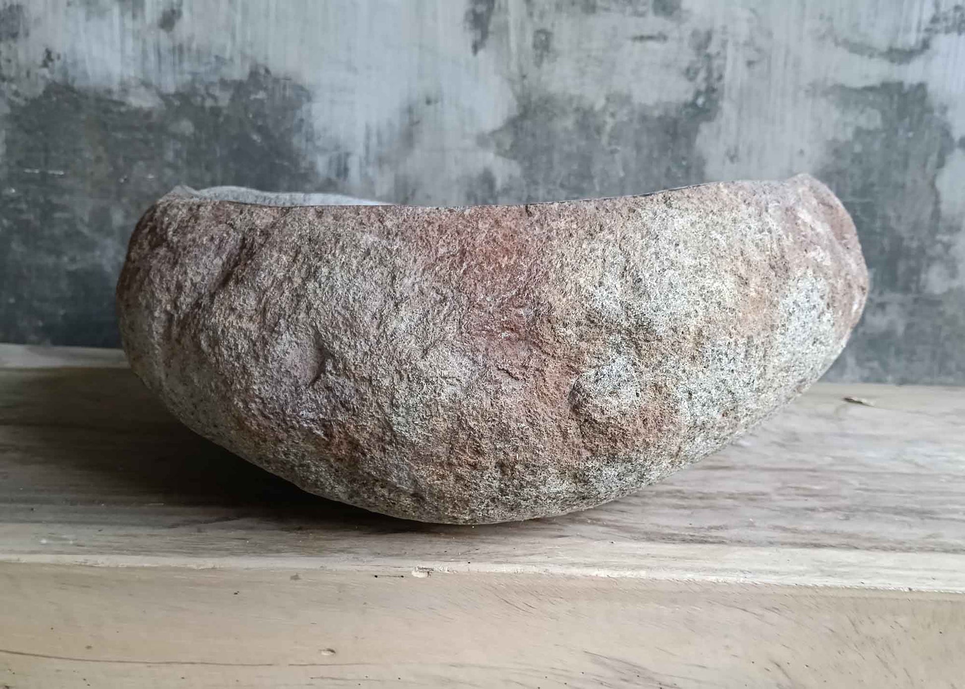 Front side of 18×15 inch river stone sink highlighting raw stone texture and form
