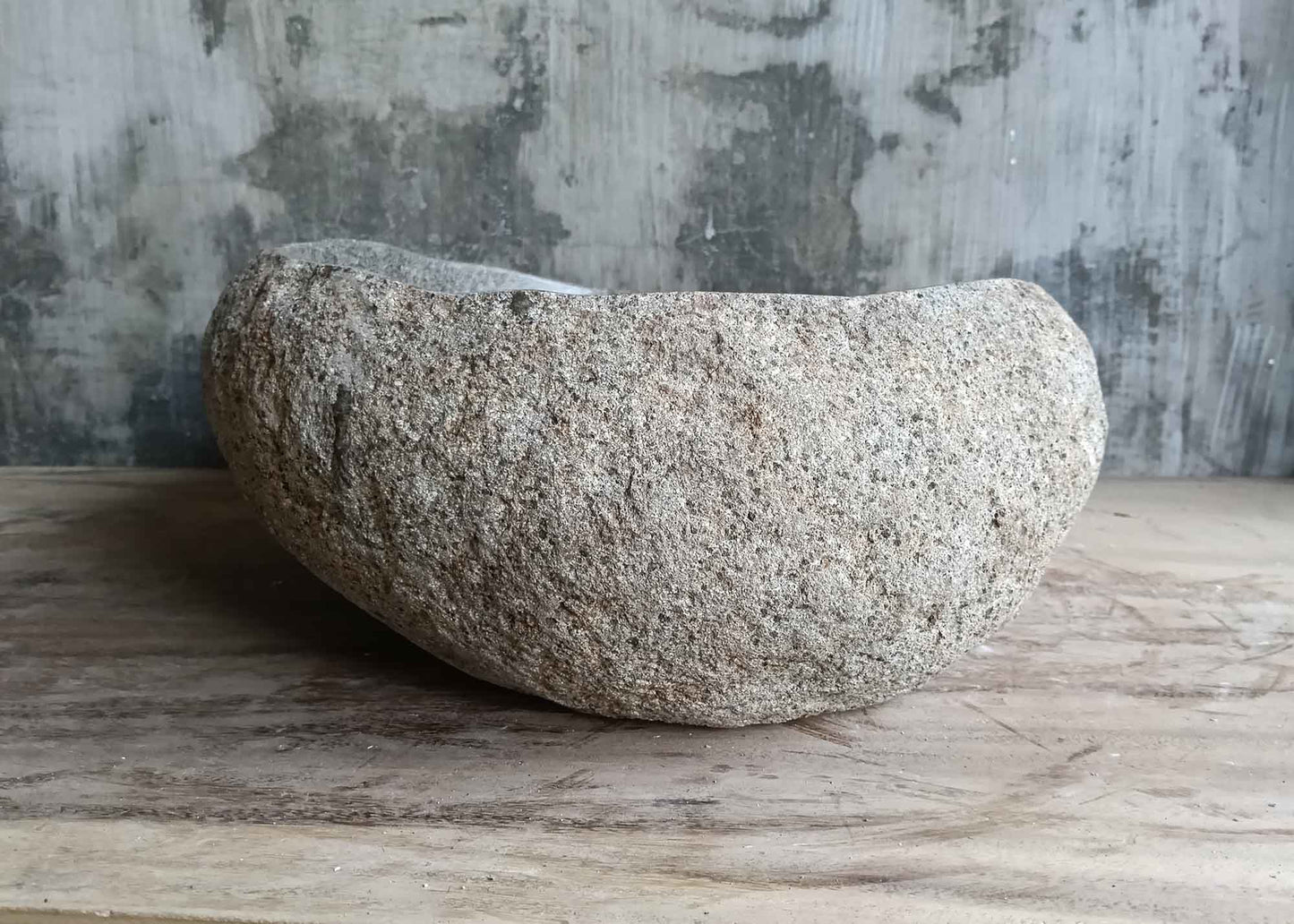 Left side of 18×15 inch river stone sink showing texture, color, and curved contour
