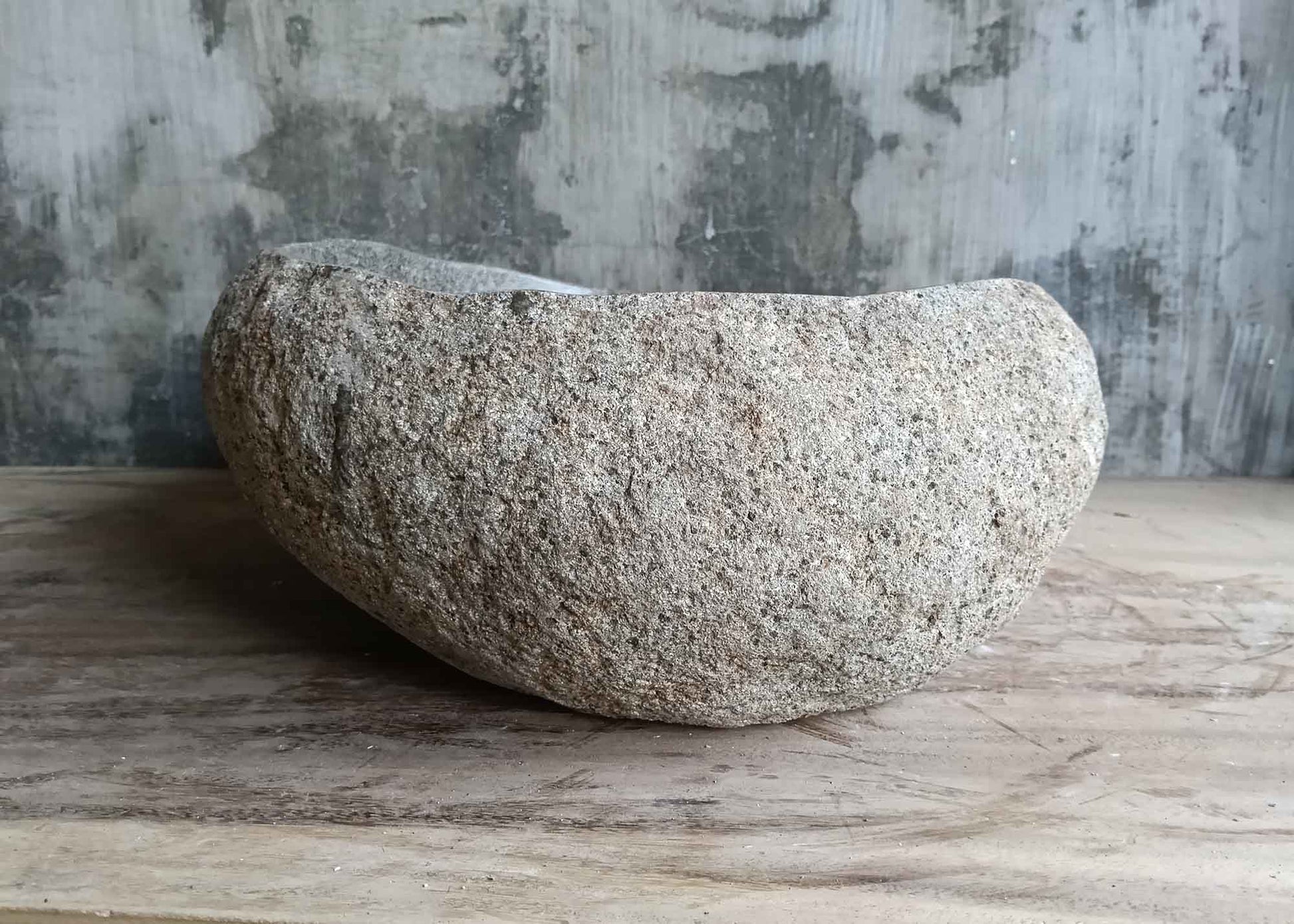 Left side of 18×15 inch river stone sink showing texture, color, and curved contour
