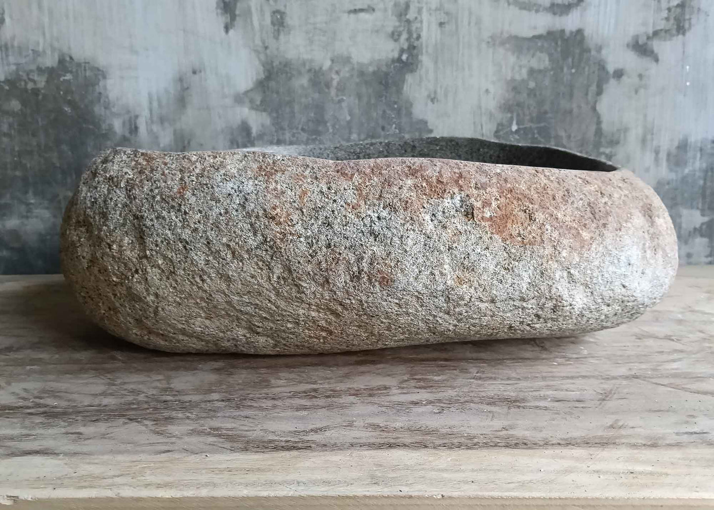 Right side view of handcrafted 18×15 inch river stone sink with natural stone details
