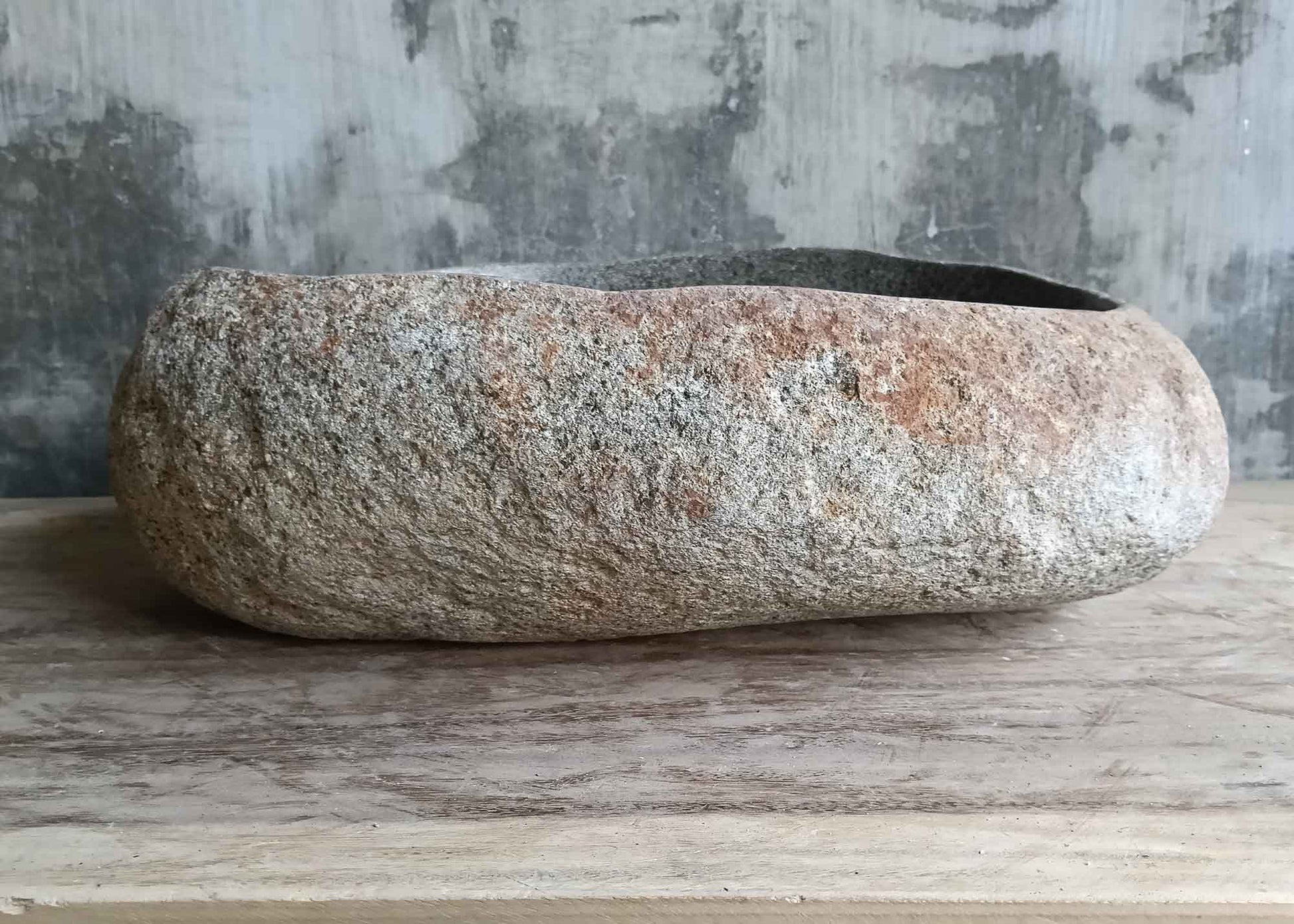 Right side view of handcrafted 18×15 inch river stone sink with natural stone details
