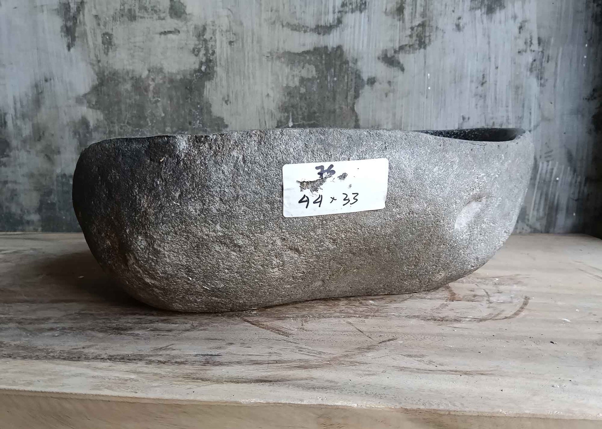 Back side view of 17×13 inch river stone sink with natural texture and handcrafted edges
