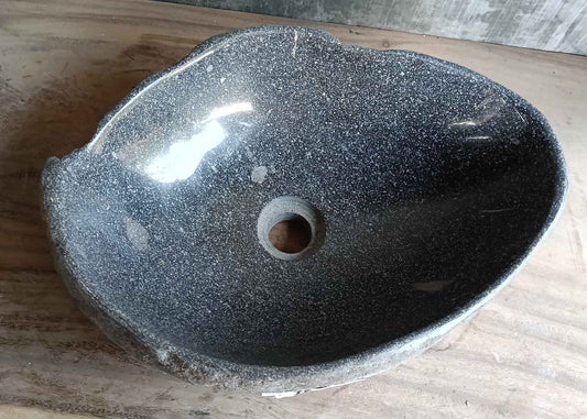 Top view of handcrafted 17×13 inch river stone sink showing oval interior and natural color
