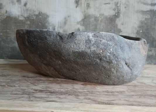 Front side of 17×13 inch river stone sink highlighting raw exterior surface and shape
