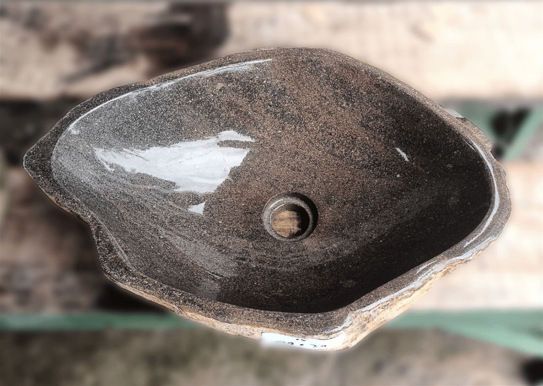 Top view of handcrafted brown 19×13 inch river stone sink with striations
