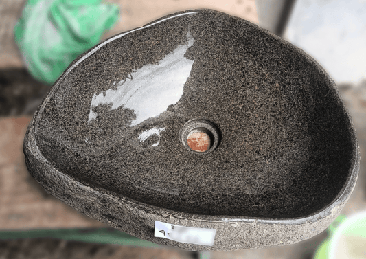 Top view of handcrafted brown 18×14 inch river stone sink in triangular form
