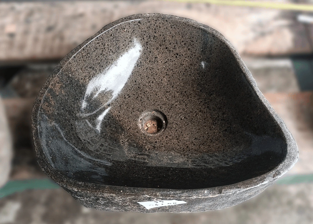 Top view of handcrafted brown 18×16 inch river stone sink in triangular form
