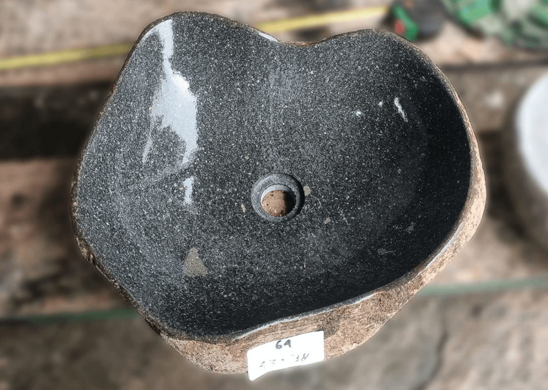 Top view of handcrafted grey 17×15 inch river stone sink in irregular form


