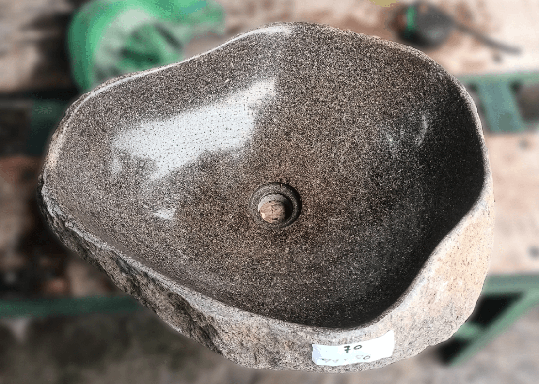 Top view of handcrafted brown 19×16 inch river stone sink in irregular form
