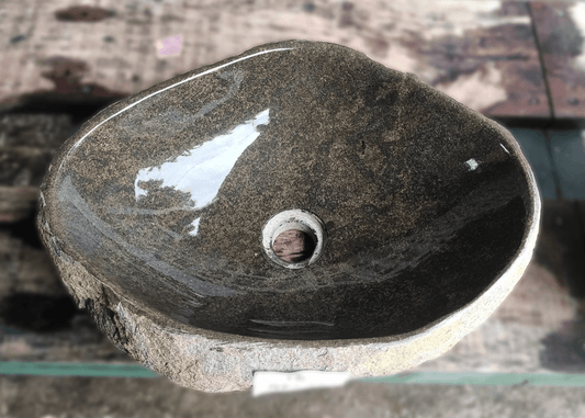 alt="Top view of handcrafted 18×13 inch river stone sink"
