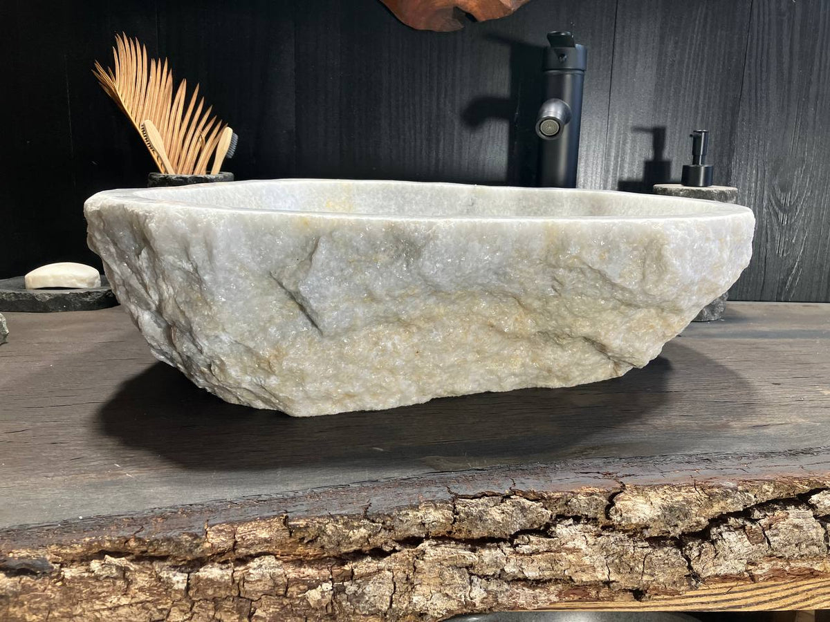 Close view of OSS-010 natural white onyx sink with rough crystalline exterior texture