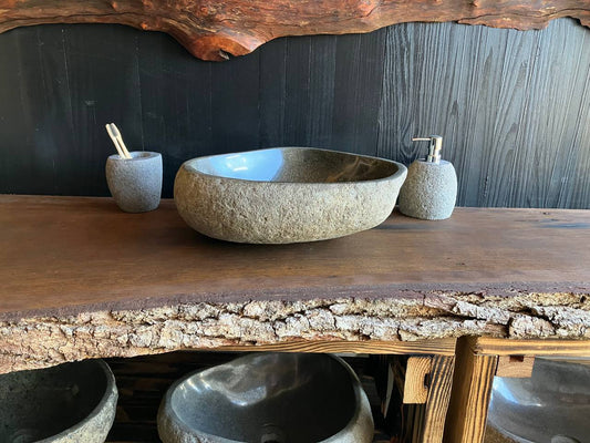 Triangular river stone vessel sink RSC-079 with a natural textured exterior