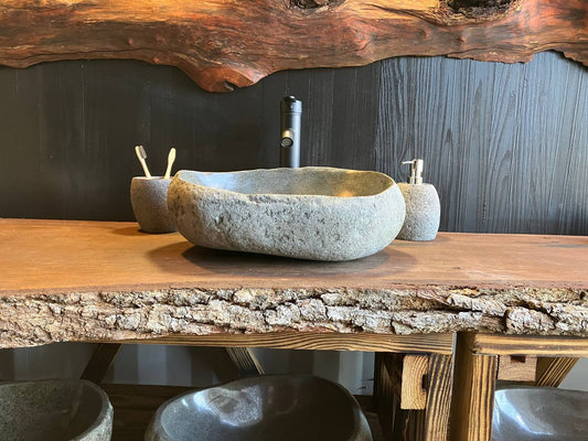 River stone vessel sink RSC-082 with a textured exterior and a rim varying from 5 to 6.25 inches high