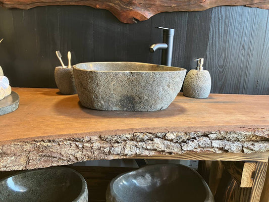 Natural river stone vessel sink RSC-083 with a textured exterior, 17 inches long