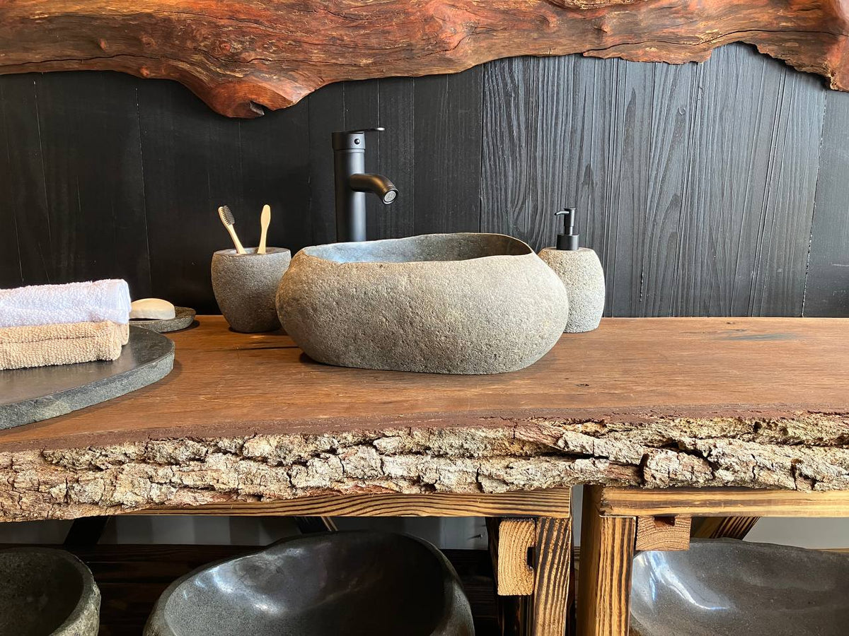 River stone vessel sink RSC-087 with a dark basin and natural textured exterior