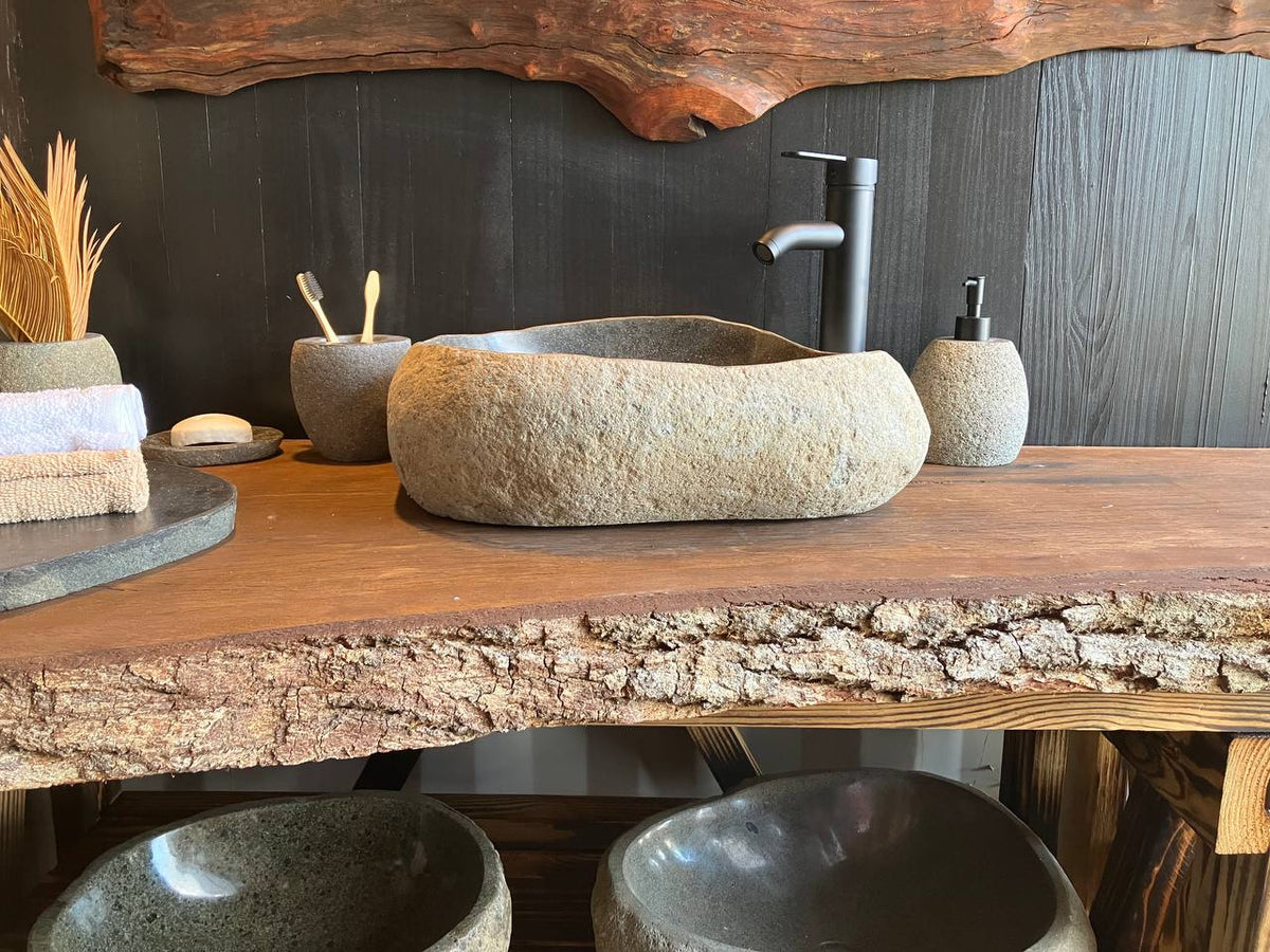 River stone vessel sink RSC-088 with a black basin and natural textured exterior