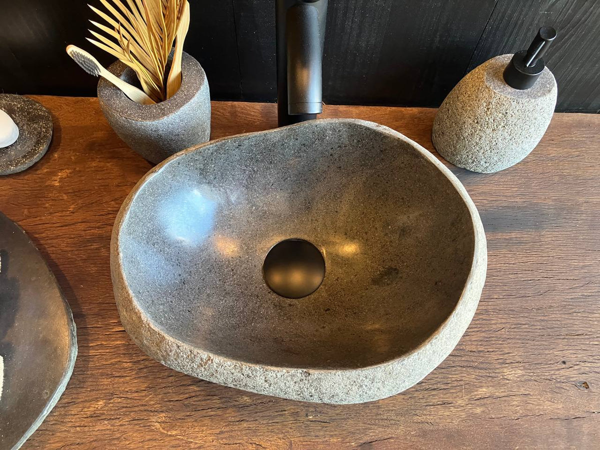 Oval river stone bathroom sink RSC-092 with a polished basin interior
