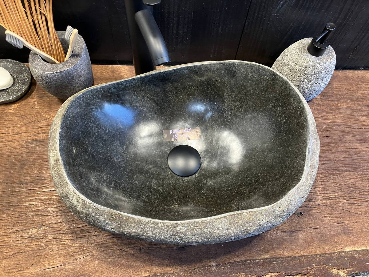 Textured gray natural stone exterior of RSS-098 riverstone sink