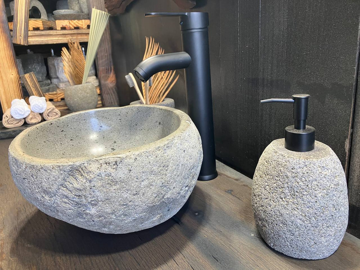 Rugged dark gray natural stone exterior of the RSS-100 sink